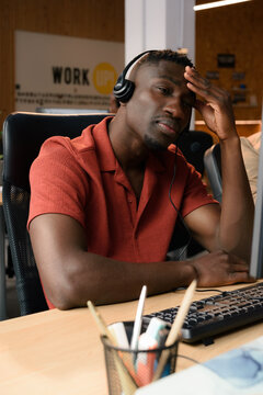 Portrait of tired call center worker 