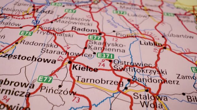 Road network from Krakow to Warsaw, Poland &ndash; gliding view over the route on an atlas map