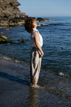 Woman enjoying sun and sea 