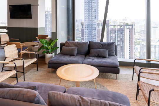 Modern Lounge Area With City View and Cozy Seating