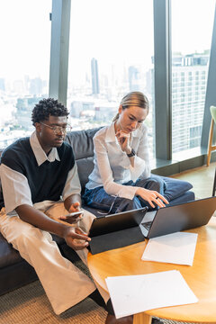 Young Adults Work Together in a Modern Office Space
