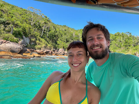 UGC Selfie Of The couple enjoys time on a boat in clear blue waters