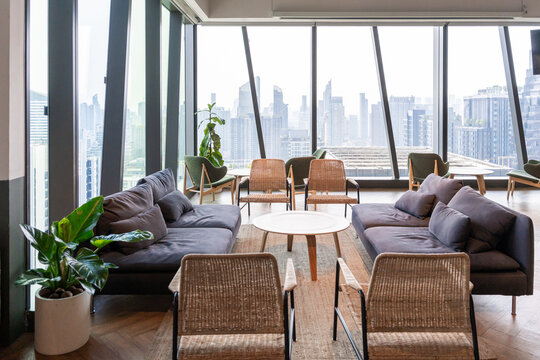 Modern Office Lounge Space With City View in Urban Building