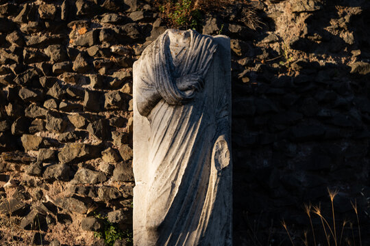 Headless ancient Roman marble statue along the Appian Way in Rome 