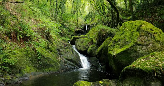 View of an idyllic waterfall on the River Edo in Castro Caldelas, Ourense, Galicia, Spain