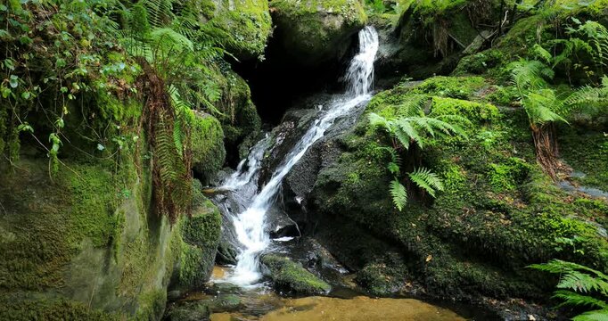 View of an idyllic waterfall on the River Edo in Castro Caldelas, Ourense, Galicia, Spain