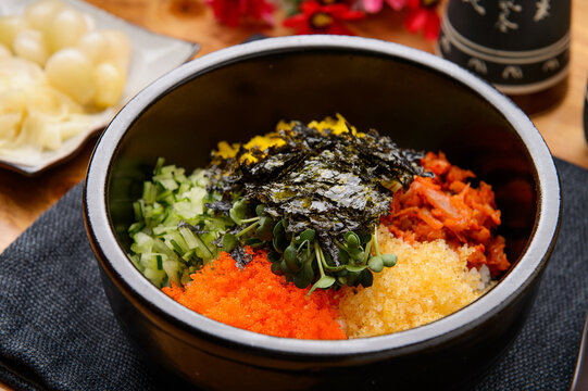 Korean mixed rice bibimbap with vegetables and fish roe