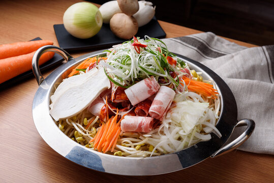 Korean hot pot jeongol with meat vegetables and rice cake in lar