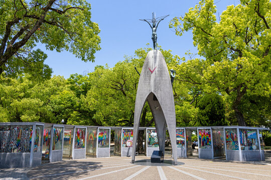 16-05-2026 Japan, Hiroshima the children's peace monument with lush green trees and sunny blue sky