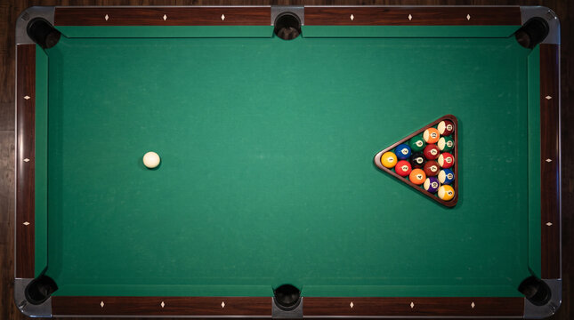 Billiard table with cue ball and racked balls, top view