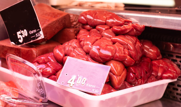 Raw cow kidney meat lies on the display case of the meat department of supermarket