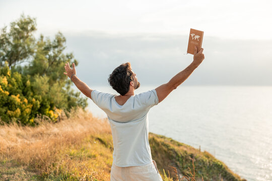 Man embracing freedom and dreaming of adventure after digital detox