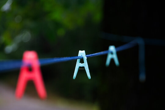 Clothespins on the clothesline closeup with selective focus