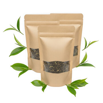 Brown paper bag with tea leaves and green herb sprigs isolated on transparent background