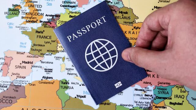 International passport against a map backdrop, representing the concepts of travel, hiking, and relocation. Passport on a map as a background for your design