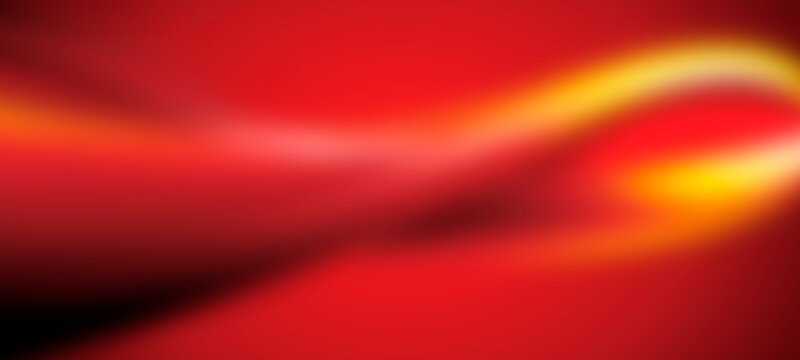 dynamic abstract red and yellow background with smooth swirling light streaks and soft focus for design