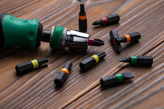 Screwdriver tips different shapes and sizes. Manual screwdriver and set of the interchangeable bits.