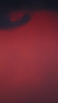 Rain clouds at sunset Time lapse.Red and Dark Cloud Composition at Dusk