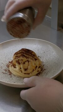Chef preparing Tiramisu in the kitchen. Restaurant process High quality FullHD footage