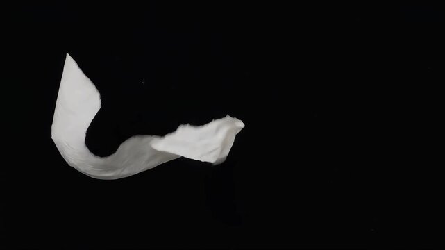 Crumpled white paper texture on black background