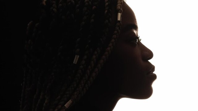 Female silhouette. Mindful contemplation. Profile portrait of peaceful pensive woman isolated on white copy space.