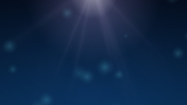 Underwater sunlight rays and bubbles deep blue ocean abstract background