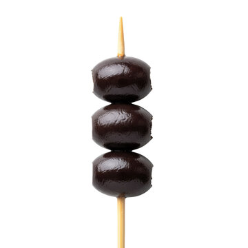 Three plump glossy mediterranean black olives skewered on a light brown wooden toothpick against a minimalist white background. Minimalist culinary concept