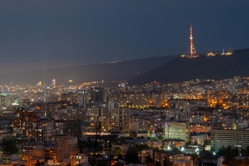 Obraz premium View of Tbilisi at night, modern residential buildings
