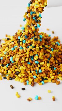 White polypropylene plastic granules pouring from a cup onto a resin pellet pile on white background, 3D render dynamic Vertical video.