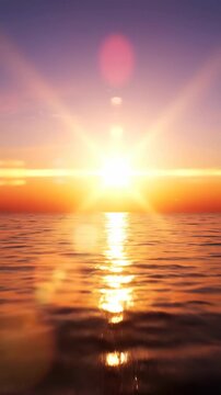 Golden Sunset Over Calm Ocean Waves with Lens Flares.