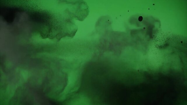High-speed aerosol paint explosion on green screen. Vibrant ink splatter burst captured in ultra-slow motion for VFX compositing.