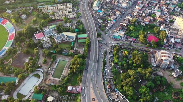 Drone shot of highway traffic and Vikram Chowk bridges over the Tawi River, Jammu city
