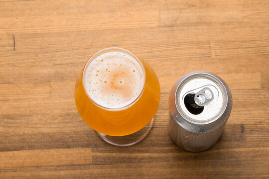 Tulip Beer Glass Beside Opened Can