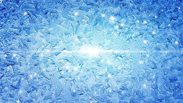 Snowflakes drift across frosted window with icy crystal patterns. Snowflakes fall before frozen winter glass. Cold crystals sparkle across frosty view creating ethereal holiday backdrop