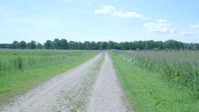 Point of view vehicle driving on rural dirt road
