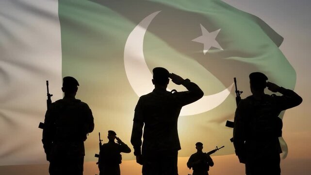 Pakistani soldiers saluting against a waving national flag