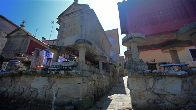 Traditional Granite H&oacute;rreos and Coastal Architecture along the Narrow Streets of Combarro in Poio, Galicia, Spain