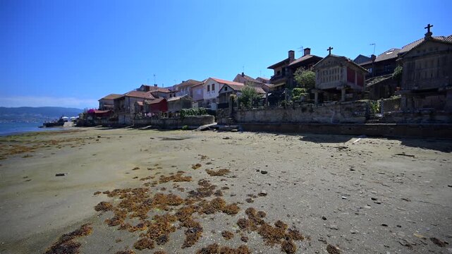 Traditional Granite H&oacute;rreos and Coastal Architecture along the Narrow Streets of Combarro in Poio, Galicia, Spain
