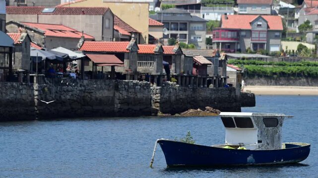 Traditional Granite H&oacute;rreos and Coastal Architecture along the Narrow Streets of Combarro in Poio, Galicia, Spain