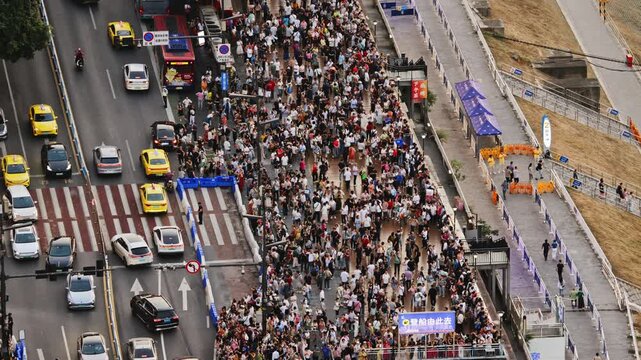  street busy with people and traffic next to hongyadong cave in chongqing