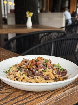 Fresh Pasta with Chanterelle Mushrooms Beef and Parmesan Cheese in Restaurant