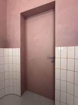 Minimalist Pink Interior Door with Ceramic Tile Wall in Modern Design