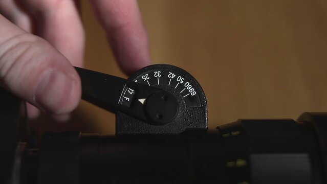 Close Examination And Manipulation Of Mechanical Dial For Precise Scope Positioning And Measurement . Media