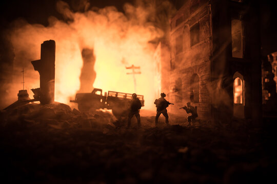 War Concept. Battle scene on war fog sky background, Fighting silhouettes Below Cloudy Skyline at night. City destroyed by war