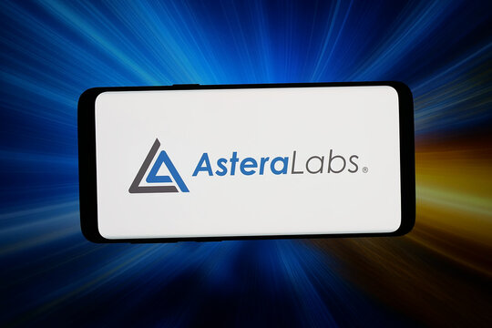 Stuttgart, Germany - 07-15-2026: In this photo illustration, the logo of US semiconductor company Astera Labs Inc. is displayed on a smartphone in front of abstract background on computer screen.