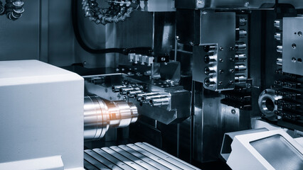 Modern programmable metalworking CNC multifunctional milling drilling grinding tool automatic machine, tech industrial technology background. © Aleksandr Matveev