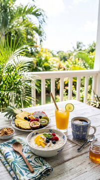 Tropical Breakfast on a Balcony with Fresh Fruits and Coffee