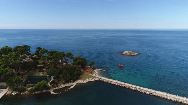 Drone view of long stone pier