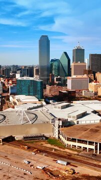Panorama of a modern Dallas, Texas, USA. Distant view of skyscrapers in the downtown of metropolis on sunny day. Vertical video