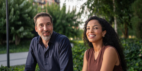 Fototapeta premium Diverse couple smiling to camera, positive connection and happiness